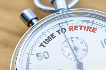 A stopwatch with the word TIME TO RETIRE, which involves transitioning from the workforce to a more...