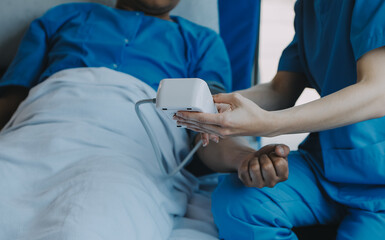 Women Asian doctors hold the patient hand and encourage and provide medical advice While checking...