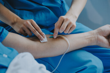 Women Asian doctors hold the patient hand and encourage and provide medical advice While checking...