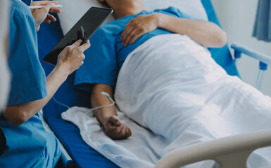 Women Asian doctors hold the patient hand and encourage and provide medical advice While checking...