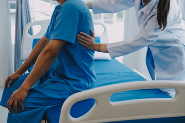 Women Asian doctors hold the patient hand and encourage and provide medical advice While checking...