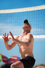 Volleyball, exercise and man at beach in competition, game or match in summer outdoor. Sports,...