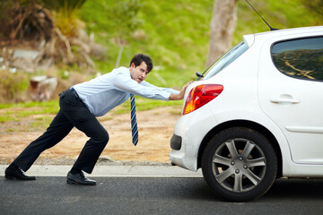 Businessman, push car or breakdown on road engine fail, emergency tyre or auto service. Male...