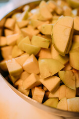 Cubes of apples in a plate. Lots of apples for jam, charlotte or strudel. Harvesting fruits for the winter. Harvest from your own garden
