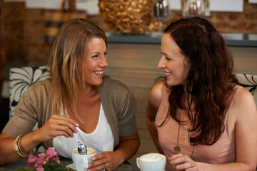 Women friends, smile and talk in cafe for reunion, thinking or happy with drink together for memory. Girl, coffee shop and relax with chat, conversation and funny joke for gossip, story or comic news