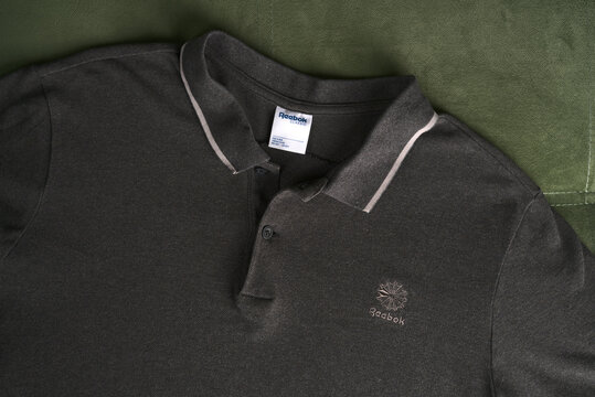 Moscow, Russia - june 8 2021: Reebok polo shirt. Simple and comfortable clothing for every day. Flatlay.