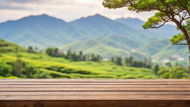 close up empty wooden desk with blurred background of tea garden on the mountain