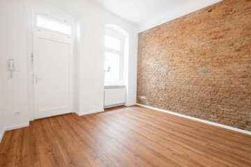 empty office or apartment  room with brickwall and wooden floor