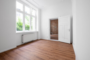 empty flat, unfurnished room after renovation with big window