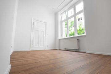 Obraz premium empty apartment room,window and flat door, low angle view
