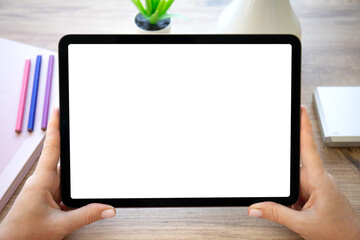 female hands hold computer tablet with isolated screen in office