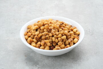 Marning, heap of crispy roasted corn kernels, traditional snack from Indonesia
