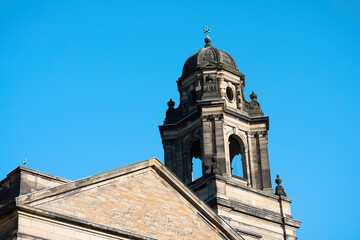 Fototapeta na wymiar Edinburgh a majestic tower adorned with a prominent cross at its pinnacle
