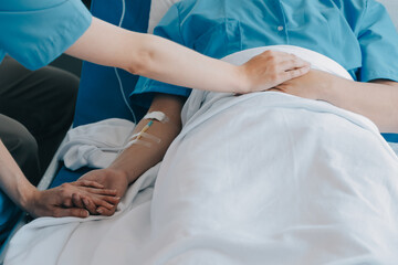Injured patient showing doctor broken wrist and arm with bandage in hospital office or emergency...