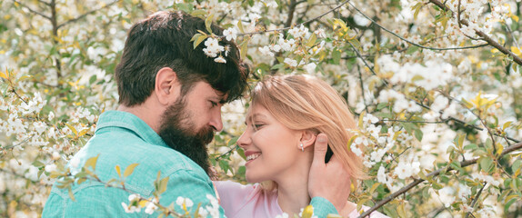 Couple in love, spring banner. Passionate affectionate man and woman enjoying exciting moment of...