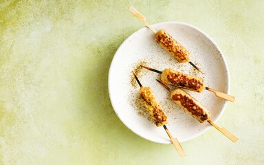 Juicy chicken kebab on a plate. Skewers. Food background with copy space. Top view.
