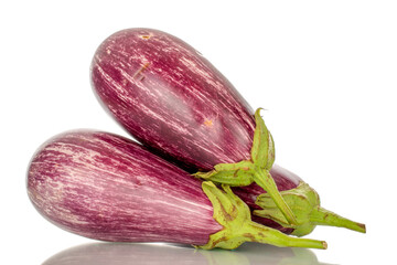 Three organic ripe eggplants, macro, isolated on white background.