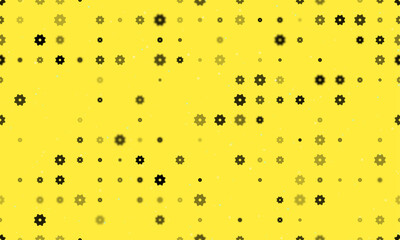 Seamless background pattern of evenly spaced black gear symbols of different sizes and opacity. Vector illustration on yellow background with stars