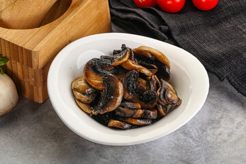 Fototapeta premium Roasted champignon mushrooms in the bowl