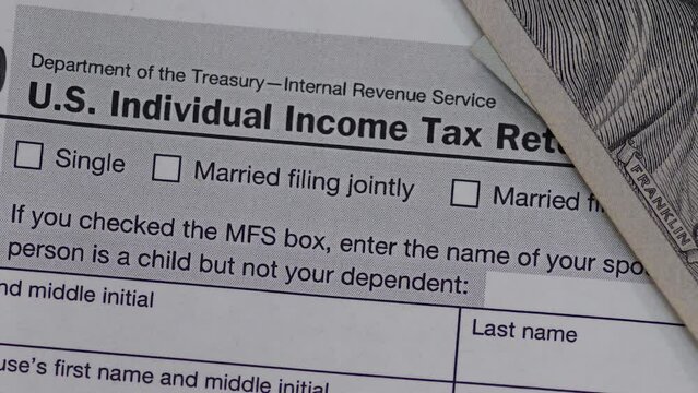 Blank Form 1040 U.S. individual income tax return. Tax payment time concept. Filing taxes document.