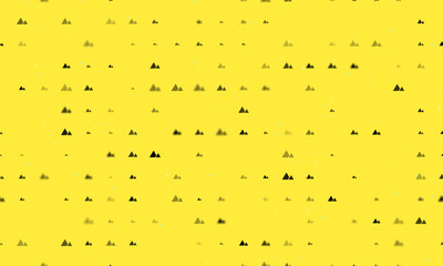 Seamless background pattern of evenly spaced black mountains symbols of different sizes and opacity. Vector illustration on yellow background with stars