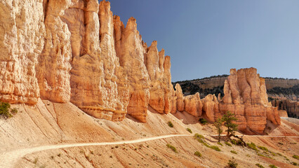 Fototapeta premium Fairytale landscape of glowing rock towers in the American Bryce Canyon.