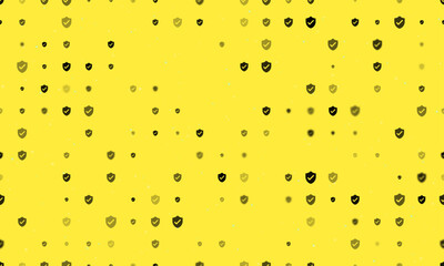 Seamless background pattern of evenly spaced black protection mark symbols of different sizes and opacity. Vector illustration on yellow background with stars