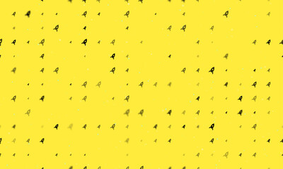 Seamless background pattern of evenly spaced black rocket symbols of different sizes and opacity. Vector illustration on yellow background with stars