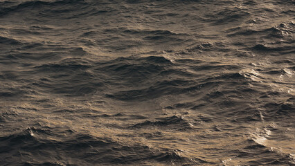 blue water sea surface with soft summer light closeup