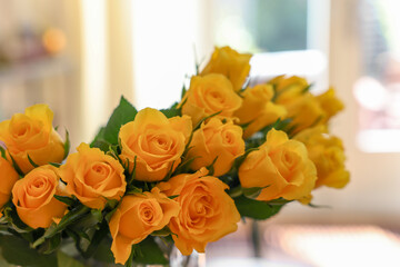 Beautiful bouquet of yellow roses indoors, closeup