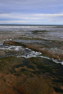 Rocks, waves and sky