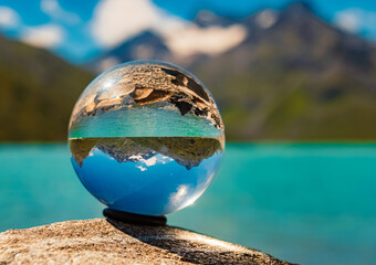 Crystal ball alpine landscape shot at Sylvretta reservoir, Sylvretta-High-Alps-Street, Vorarlberg,...