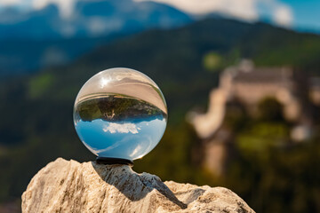 Crystal ball alpine landscape shot with fortress Hohenwerfen at Werfen, Pongau, Salzburg, Austria