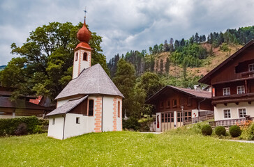 Fototapeta na wymiar Chapel on a cloudy summer day at Thal, Lienz, Tyrol, Austria