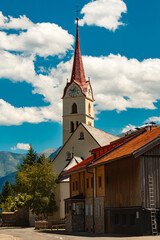 Fototapeta na wymiar Church on a sunny summer day at Galtuer, Landeck, Tyrol, Austria