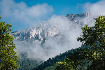 Clouds lingering on the limestone cliffs of the Glandasse mountain in Vercors, near Chatillon en Diois in the south of France (Drome)