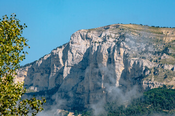 Clouds lingering on the limestone cliffs of the Glandasse mountain in Vercors, near Chatillon en Diois in the south of France (Drome)