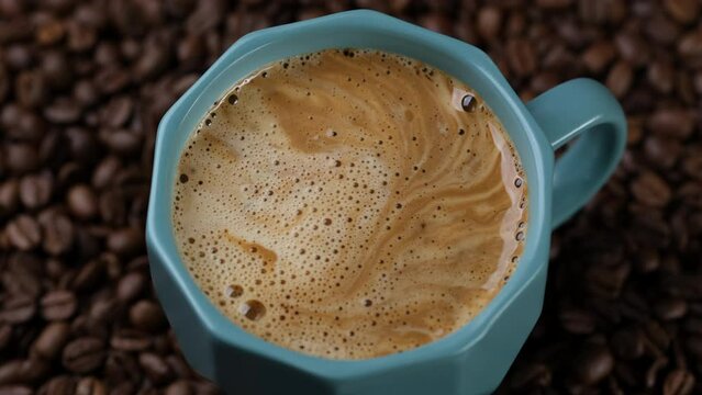 Hot instant coffee with foam close up
