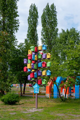 Fototapeta na wymiar VORONEZH, Russia, May 14, 2023: Colorful birdhouses in Victory Park in Voronezh in summer