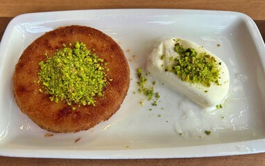 Künefe dessert with icecream in plate.