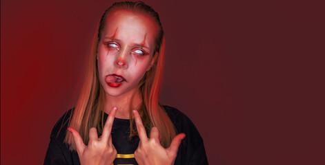 Girl with make up for Halloween on red background.