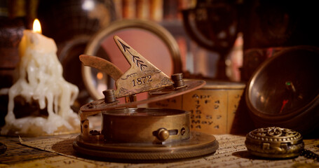 Vintage style travel and adventure. Vintage old compass and other vintage items on the table.