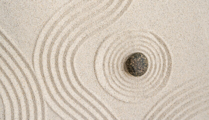 Fototapeta na wymiar Zen stone garden Japanese top view, Circle round sand background, Meditation of Buddhism 