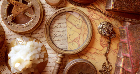 Fototapeta na wymiar Vintage style travel and adventure. Vintage old compass and other vintage items on the table.
