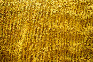  Close-up view of a vibrant green textured textile cloth.