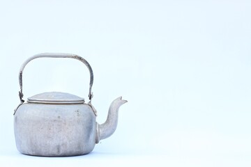 Vintage large aluminum tea pot kettle stove top isolated on white background with clipping path