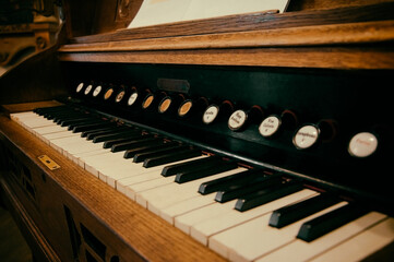 vintage wooden pianino with black and white keys. High quality photo