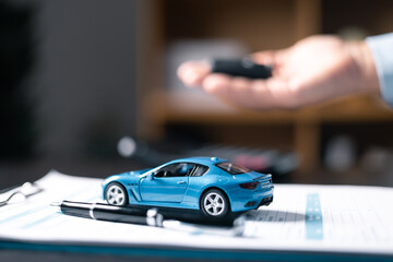 Car dealers or insurance managers cover and protect against damage and the risk of driving, Hold the car keys, Protecting and after-sales care concept. offering financial and insurance service.