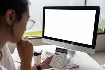 businesswoman accountant using calculator for checking financial data saving in office room