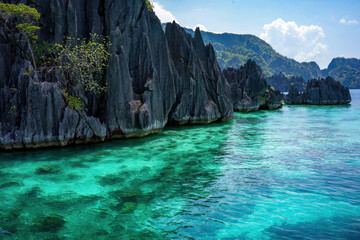  Jagged cliffs juxtaposed with the tranquil turquoise waters